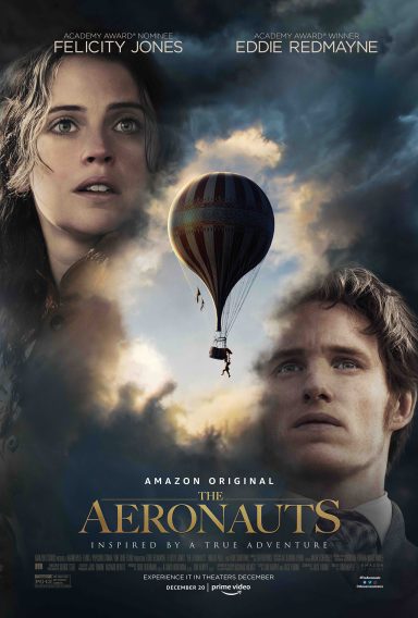 Aeronauts A woman and a man look upwards towards a hot air balloon against a cloudy sky.